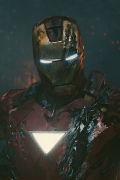 iron man standing in front of a dark background