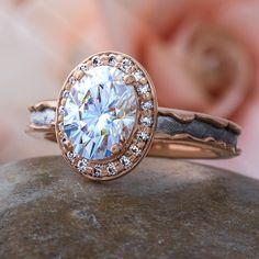 a close up of a ring on top of a rock