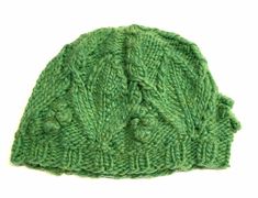 "This is a hand knit green alpaca blend beanie. The motif is a leaf with a cable extending to the center to form a star. There are five leaves around the hat. Its a small beanie measuring 7.5\" from top to bottom edge. Its stretches to fit a 24\" head. Hand wash in cold and lay flat to dry." Green Knitted Beanie Hat, Green Knitted Beanie One Size Fits Most, Green Knitted Beanie One Size, Green Knitted Beanie (one Size Fits Most), Green Hand Knitted Beanie One Size, Green Hand Knitted One Size Beanie, Green Knitted Yarn Beanie, Green Hand Knitted Yarn Hat, Hand Knitted Green Yarn Hats