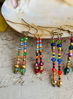 "Colourful beaded stick earrings.  made with beautiful Miyuki Beads,  Swarovski , czech crystal and various other stones like tourmaline Jasper and carnelian  Very unique and pretty ..  most are an inch and a half - 2 \" but they can be made shorter...  Please choose number upon checkout -sorry #1  N/A  thank you 😊  ❀ To maintain great quality jewelry I use gemstones, semi precious stones, pearls and crystals ( swarovski, czech and austrian) in my Jewelry. I guarantee every piece for you~ Thank Czech Beads Jewelry, Semi Precious Stone Jewelry, Knotted Jewelry, Czech Jewelry, Stone Bead Jewelry, Crystals Swarovski, Into The West, Stick Earrings, Beading Jewelery