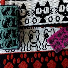 three crocheted cat and dog wristbands on display