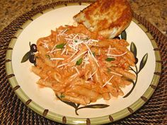 a plate with some pasta and bread on it