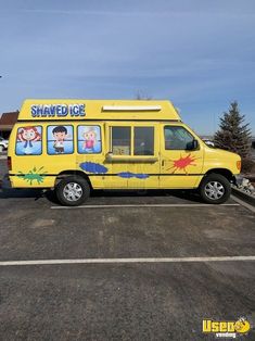 a yellow van with cartoon characters painted on it's side in a parking lot