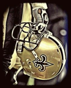 a football helmet with the new orleans saints on it's face is seen in this photograph