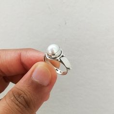 Important : PLEASE ENTER YOUR PHONE NUMBER IN THE "NOTE TO SELLER" SECTION DURING CHECKOUT, SO THAT THE DELIVERY CAN BE HASSLE FREE.Material: Solid Sterling silver Stone: pearl stone size: varies( According to the ring sizes)ships worldwide from India925 stampedHandmade itemOur products are totally handmade and made with high quality gemstones and 925 solid sterling silver.If you believe in buying top quality products for yourself and for your family and friends, SilverDynasty is the place where Sterling Silver Open Pearl Ring With Polished Finish, Silver Pearl Promise Ring With Round Band, Silver Sterling Pearl Ring, White Gold Sterling Silver Open Pearl Ring, Stackable White Gold Pearl Ring, Sterling Silver Pearl Promise Ring, Sterling Silver Pearl Ring For Anniversary, Sterling Silver Pearl Promise Ring With Round Band, Anniversary Sterling Silver Pearl Ring With Round Band