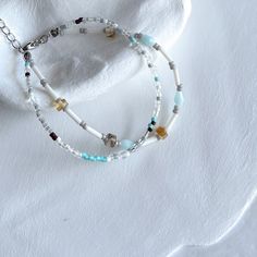 This beautiful handmade bracelet features two delicate strands of turquoise, amber, and clear glass beads. The combination of soft blue, amber, and clear hues creates an elegant and versatile accessory that can be paired with any outfit. The bracelet is finished with a sturdy lobster clasp and an adjustable chain to ensure a perfect fit. Adjustable length High-quality glass beads Handmade with love and care ✴︎Each design is created in extremely limited quantities, with only 1 or 2 pieces made per style. This exclusivity ensures that you are purchasing a truly unique piece of jewelry that stands out. Bracelet Miyuki, Miyuki Bracelet, Blue Amber, Bracelet Bead, Unique Bracelets, Beads Handmade, Bracelets Handmade Beaded, Handmade Bracelet, Adjustable Bracelet