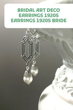 These 1920s inspired pearl dangles feature luminous white Swarovski crystal pearls that dangle from antiqued silver plated Art Deco style connectors. The silver plated connectors are brass stampings, which have an ornate front and a back that is the hollow reverse of the front. Vintage Dangle Bridal Earrings For Anniversary, Vintage Nickel-free Earrings For Wedding, Nickel-free Vintage Wedding Earrings, Nickel Free Vintage Wedding Earrings, Vintage Wedding Chandelier Earrings For Pierced Ears, Elegant Vintage Charm Wedding Earrings, Vintage Chandelier Earrings For Wedding, Elegant Vintage Charm Earrings For Wedding, Vintage Charm Earrings For Wedding