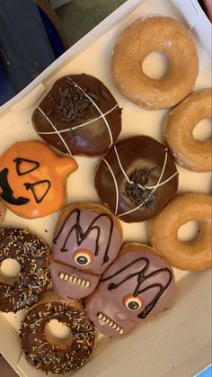 a box filled with lots of donuts covered in frosting