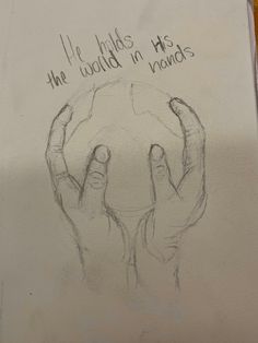 a drawing of two hands holding a globe with the words, he holds the world in his hands