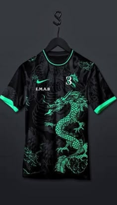 a black shirt with green dragon on it