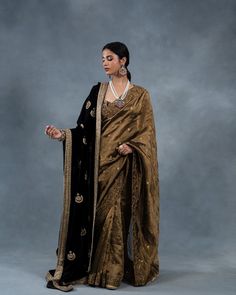 Introducing our Silk Velvet Chand Bali Dushala, a luxurious masterpiece of traditional craftsmanship. Adorned with intricate hand-embroidered Zardozi work, this exquisite shawl features a rich antique gold border, infusing opulence and elegance into any ensemble. Visit us at B-25, Defence Colony, New Delhi. We look forward to your presence. www.richaahluwalia.com/collection/chandbali-black-doshala-wedding-saree/ To schedule an appointment or arrange a video call, please dial +91 8800880840.... Saree With Velvet Shawl, Saree With Shawl, Tangled Wedding, Shawl Outfit, Saree Styling, Chand Bali, Formal Saree, Shadi Dresses