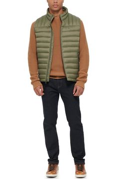 A quilted stand collar and lightweight fill insulate this heat-keeping puffer vest. 26 1/2" length (size Medium) Stand collar Front zip closure Front zip pockets Water resistant 100% nylon Machine wash, tumble dry Imported Casual Down Outerwear With Zipper Closure, Casual Down Quilted Jacket For Spring, Casual Nylon Quilted Jacket, Casual Quilted Nylon Outerwear, Casual Down Puffer Jacket With Padded Collar, Casual Quilted Nylon Vest, Casual Nylon Vest For Cold Weather, Casual Down Puffer Vest, Casual Insulated Down Outerwear