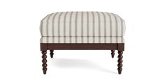 the foot stool is made from wood and has striped upholstered fabric on it