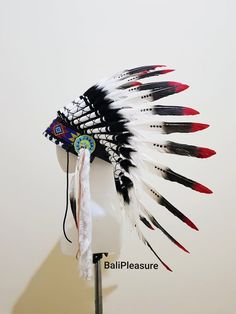 White Black & Red Feather Indian HeaddressThis Headdress is 100% handmade from Feathers and Leather.* Head circumference: 59 centimeters / 23 inches* Length : Short* Please input your phone number for shipment inquiry---------------------SHIPPING INFO- Standard Shipping : Estimated around 7-15 business days.- Express Shipping : Estimated around 3-5 business days.* Canada shipment will using Express Shipping with 3-5 business days delivery.* Shipping upgrades available when checkout.* We provide Red Fitted Hat For Festival, Fitted Red Festival Hat, Traditional Handmade Costume Hats And Headpieces, Ceremonial Black Adjustable Headpieces, Adjustable Black Ceremonial Headpiece, Traditional Fitted Headpiece For Festivals, Adjustable Red Hat For Carnival, Fitted Red Costume Hats And Headpieces For Festival, Red Fitted Costume Hats And Headpieces For Festivals