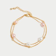 Discover the stunning beauty of real freshwater pearls with this layered bracelet. With beautiful shades of ivory and delicate pink, this bracelet will definitely elevate any outfit. 18K gold plated Freshwater pearl Length: 6.1in (+ 1.8in adjustable) Lobster clasp closure Hypoallergenic, lead & nickel free If you a Celine Pearl, Layered Bracelet, Bubble Bag, Black Gift Boxes, Halloween Sale, Cool Store, Layered Bracelets, High Quality Jewelry, Ladies Day