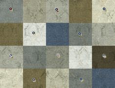 a patchwork quilt with different colors and patterns