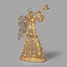 an angel figurine with lights on it's body and wings, in gold