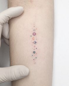 a person with a small tattoo on their arm