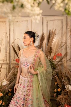 A pink, hand-embroidered zardozi lehenga with floral and geometric pattern is paired with a dainty checkered blouse and mint green dupatta.by Chamee and Palak.DELIVERY TIMEPlease allow 4-6 months for your outfit to arrive. FABRIC DETAILSRaw silk, Net Zardozi Lehenga, Green Dupatta, Checkered Blouse, Change Image, 12 Weeks, Lehenga, Mint Green, 6 Months, Hand Embroidered