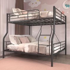 a bunk bed with two sets of mattresses on the bottom and one set of pillows on top