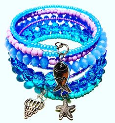 Mermaid Glass and Crystal Memory Wire Wrap Bracelet in Shades of Blue and Purple Handmade Blue Wrap Bracelet For Beach, Ocean-inspired Blue Charm Bracelet For Gifts, Handmade Blue Charm Bracelet For Beach, Ocean-inspired Blue Charm Bracelet For Beach, Trendy Jewelry Ideas, Memory Wire Wrap Bracelets, Wire Wrap Bracelet, Mermaid Glass, Wire Wrapped Bracelet