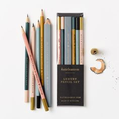 several pencils are lined up next to each other on a white surface with the title kaalenanon luxury pencil set