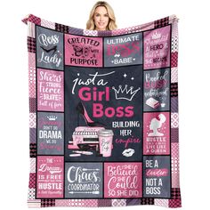 a woman holding up a pink and black blanket that says, just a girl boss