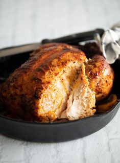 a roasting pan filled with chicken and potatoes