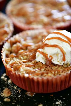 several desserts with ice cream and caramel drizzled on the top