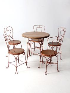 four chairs and a table are shown against a white background