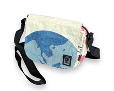 "A small and wonderful lightweight crossbody day purse. - overflap with magnetic snap, zip closure, interior zip pockets, interior slip pockets, adjustable nylon shoulder strap - Interior lining is made from recycled plastic bottles - Specs: 6\"T x 8.75\"W x 1.5\" - Clean with a damp towel or, if necessary, you can throw it in the washing machine and hang to dry. Do not put it in the dryer." Eco Backpack, Dopp Bag, Yoga Bag, Kids Blankets, Travel Wallets, Small Crossbody, Cross Body Bag, Corporate Gifts, Recycled Plastic