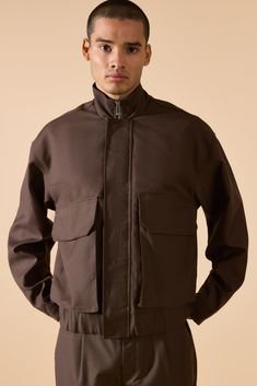 Keep out the chill while looking slick in a boohooMAN coat. Rev up your outerwear inventory this season with our unrivalled collection of coats and jackets for men. Whether you're looking for a heavy coat to combat the low temperatures, or a lightweight jacket to stand out while having fun at your favourite festival, we've got the trendiest designs to finish off your outfit with. Puffers, parkas and borg jackets are the perfect choices if you want to bundle up without sacrificing on style, and Urban Style Parka For Streetwear In Fall, Oversized Utility Jacket With Multiple Pockets For Fall, Fall Hooded Outerwear With Ribbed Cuffs, Trendy Fall Utility Jacket With Cargo Pockets, Fall Trendy Utility Jacket With Cargo Pockets, Trendy Outerwear With Flap Pockets For Winter, Trendy Winter Outerwear With Flap Pockets, Urban Stand Collar Track Jacket For Fall, Urban Track Jacket With Ribbed Cuffs For Fall