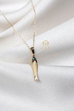 "ABOUT PRODUCT This 14K solid gold fish Pendant necklace is beautifully designed and hand crafted with our associates to make this a special gift for your loved ones. Knowing the value of our customers, We prepare each piece with extra care and attention.  ITEM DETAILS Material: 14K Gold Approx:  1.95 gram Available colors: Gold, Rose Gold, White Gold Available Sizes: 14\" to 20\" ✪ 14k Solid Gold ( Certification will be included with your order ) ✪Available 14K White, Yellow, Rose Gold (also in Traditional Fish-shaped Jewelry For Gift, Traditional Fish-shaped Jewelry Gift, Gold Fish-shaped Necklace For Gift, Gold Fish Necklace, Stone Fish, Fish Pendant Necklace, Fish Necklace, Fish Pendant, Necklace Stone