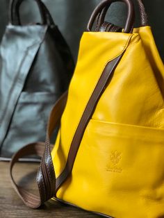 A great way to add color to your outfit!  This Italian leather backpack is fun and functional. Lots of zip pockets and a zip closure to keep your valuables secure. Great gift for a traveler or that adventurous soul! #backpackbags #travelbags #travelbagsforwomen #giftforher #giftideas #pursebag  #yellowleatherpurse #yellowfashion #fashionbackpacksbags #fashionbackpackspurse Versatile Leather Backpack With Cell Phone Pocket, Versatile Leather Backpack With Cell Phone Pocket For Everyday, Everyday Leather Backpack With Cell Phone Pocket, Trendy Leather Backpack With Cell Phone Pocket, Modern Leather Backpack With Cell Phone Pocket, Leather Backpack With Cell Phone Pocket For School, Modern Leather Backpack For Travel With Cell Phone Pocket, Modern Leather Backpack With Cell Phone Pocket For Travel, Modern Leather Travel Backpack With Cell Phone Pocket