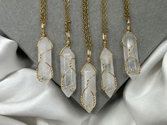 "Save when you shop through my website, I'd appreciate it 💚- https://shorturl.at/dGU49 Gain clarity and manifest your deepest desires with these ethereally wire wrapped gold Clear Quartz crystal point necklaces.  Crystal healing benefits  🔮 For protection, harmony & balance - known for its high vibrations, Clear Quartz can clear your mind, body, and spirit & purify spiritually, emotionally, mentally & physically. 🔮 Directs and amplifies energy - perfect for manifesting & meditation.  🔮 Brings clarity, which allows you to understand exactly what you desire (as the universe needs specifics).  🔮 See your ideal life in your mind's eye, manifest your desires & create your dream reality.  Chains (tarnish resistant stainless steel) 1. Cord (2mm) 18-20\"  2. Cable (2mm) 14\",16\", 18\" or 20\ Handmade Elegant Crystals For Gifts, Elegant Handmade Crystals For Gift, Manifesting Meditation, Necklaces Crystal, High Vibrations, Crystal Point Necklace, Collar Bone, April Birthstone, Pendant Gold