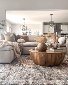 a living room filled with furniture and pillows