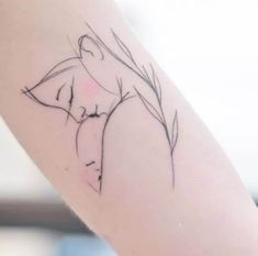 a woman's arm with a flower tattoo on the left side of her body