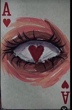 an ace playing card with a heart painted on it's eye and in the middle of the frame