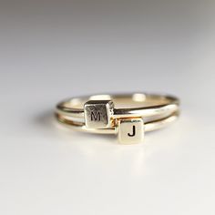 "A lovely personalized initial ring. Minimal, geometrical and modern look. Cute dainty ring is made of 14k solid yellow gold and initials engraving on the cube for your request. * Cube is 4x4mm and 2.5mm height. * Band is 1.3mm thick. * Only one character for each ring. Any initial is available from the drop down menu. TURN AROUND TIME This rings are custom made to orders so please allow us 1-2 weeks. RING SIZE : Please choose your ring size from drop down menu. --------------------------------- Minimalist Stackable Initial Ring For Anniversary, Adjustable 14k Gold Initial Ring, Modern Stackable Initial Ring For Anniversary, Modern Adjustable Initial Ring For Anniversary, Modern Personalized Stackable Rings For Everyday, Modern Personalized Everyday Stackable Rings, Modern Personalized Adjustable Stackable Rings, Minimalist Stackable Rings With Initials For Anniversary, Modern Adjustable Initial Ring For Everyday