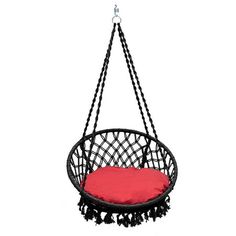 a black hanging chair with red cushion