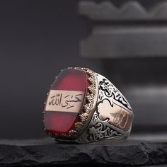 Arabic "God is Enough for me" Written Red Amber Gemstone Islamic Sterling Silver Ring for Men, Muslim Silver Ring, Arabic Calligraphy Ring A special 925 sterling silver ring is engraved with the Arabic inscription "Allah is Enough for Me" in a red fire amber stone. *General Description* -All Kuyumcuzade products are made of 925 sterling silver. -All Kuyumcuzade products are handcrafted. -The product ordered from Kuyumcuzade is specially prepared for the person who ordered it, according to the de Allah Is Enough For Me, God Is Enough, Desired Features, Silver Ring For Men, Bentwood Rings, Amber Gemstone, Sterling Silver Mens Rings, Black Onyx Stone, Amber Stone