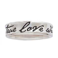 a silver ring with the words true love was written on it