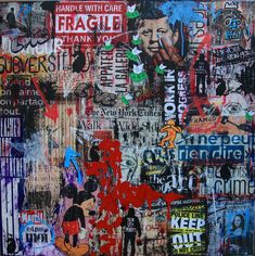 a painting with many different types of stickers and words on the side of it