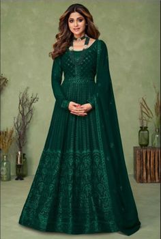 Bring to light your mystic and hidden beauty as step out in this green colored Anarkali Suit. this georgette Anarkali Suit is beautifully adorned with embroidery and embellished work as shown. This beautiful anarkali suit is the epitome of elegance, perfect for festivals and special occasions. Product Details: Color: Green Work: Embroidered Fabric: Top: Georgette Measurement: Customize Party Wear Long Gowns, Green Anarkali, Evening Wear Dresses, Abaya Style, Salwar Dress, Dress Salwar Kameez, Designer Anarkali, Anarkali Gown, Indian Gowns