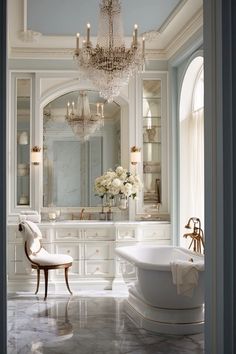 an elegant bathroom with chandelier and tub