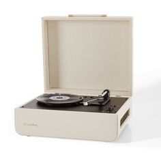 a record player in a white box on a white background