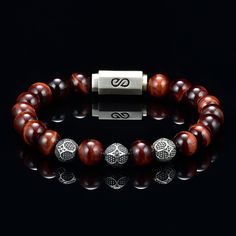 Genuine Tiger Eye Bead Bracelet for Men or Women Red Steel Cable Custom Silver Magnet Clasp Custom Silver Beads 8mm - AAA Quality Tiger Eye Premium Bead Bracelet with round 8 millimeter beads combined with a silver logo magnetic clasp. Comes with a premium leather logo box. You will not find the quality of beads I use which are 5A quality rated, the custom silver beads and high quality custom made silver clasp I use for my bracelets at any where close to the value I offer. I use the absolute bes Eye Bead Bracelet, Bead Bracelet For Men, Men's Bracelets, Blue Tigers Eye, Tiger Eye Beads, Silver Logo, Eye Beads, Mens Beaded Bracelets, Bracelet For Men