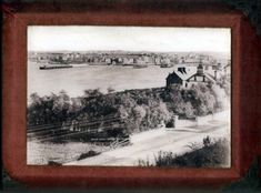 an old black and white photo of a river