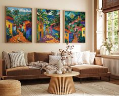 a living room with two paintings on the wall