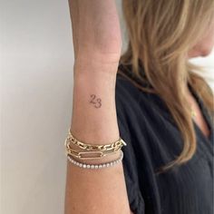 a woman with a tattoo on her arm